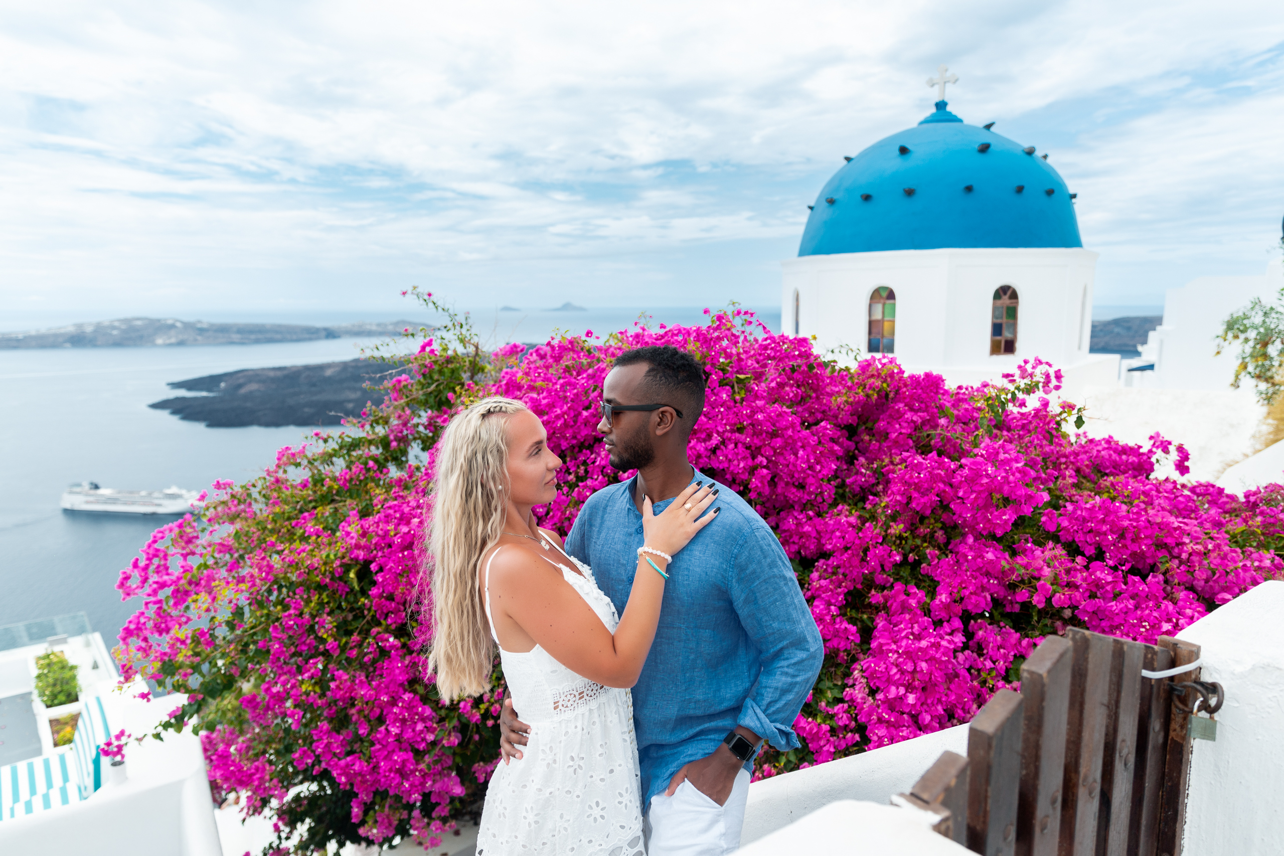 Santorini love story photoshoot. Santorini Photographer. Santorini. Santorini Photoshoot. Flying Dress Photoshoot in Santorini. Santorini Photography. Proposal Santorini
