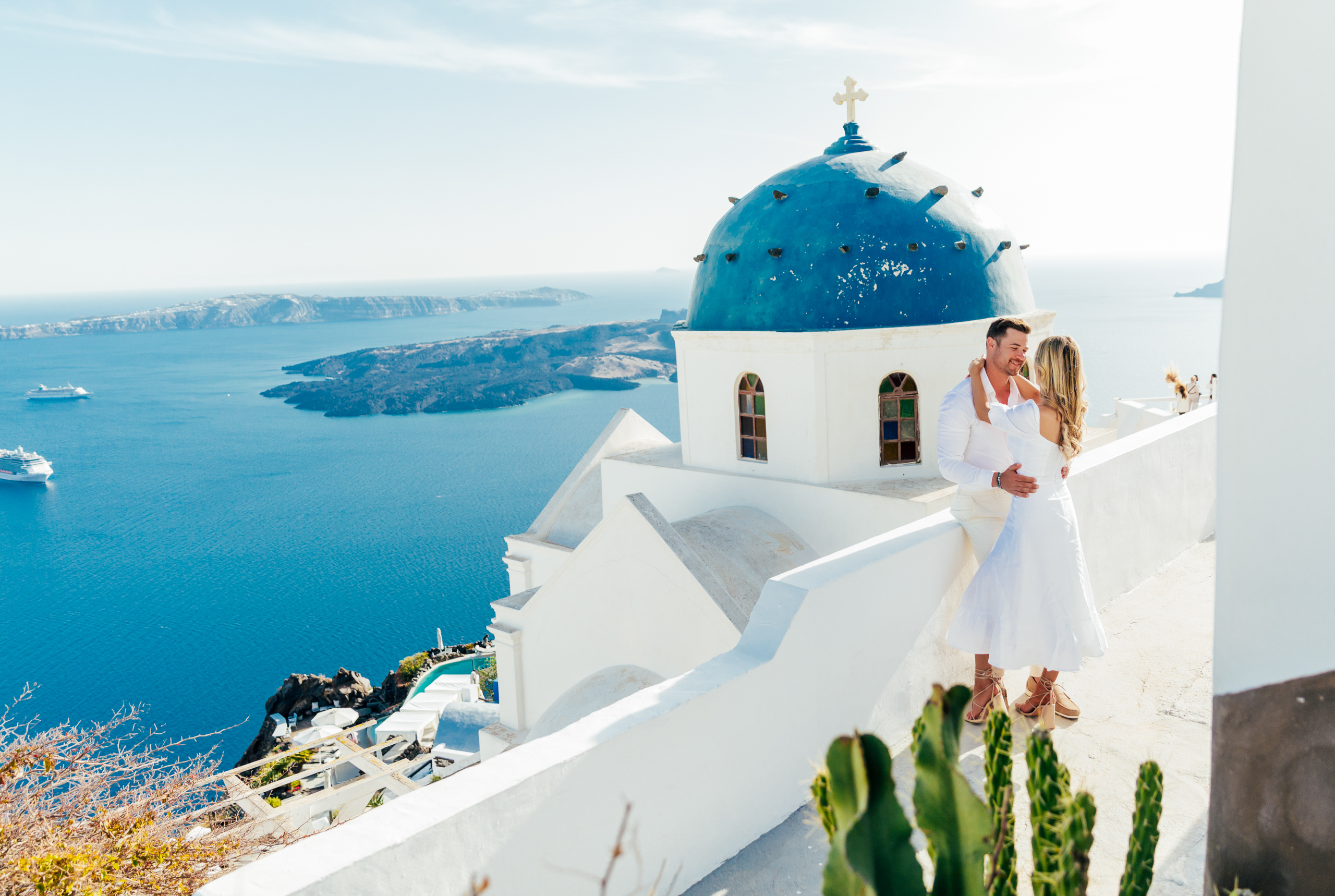 Proposal Santorini. Santorini love story photoshoot. Santorini Photographer. Santorini. Santorini Photoshoot. Flying Dress Photoshoot in Santorini. Santorini Photography.