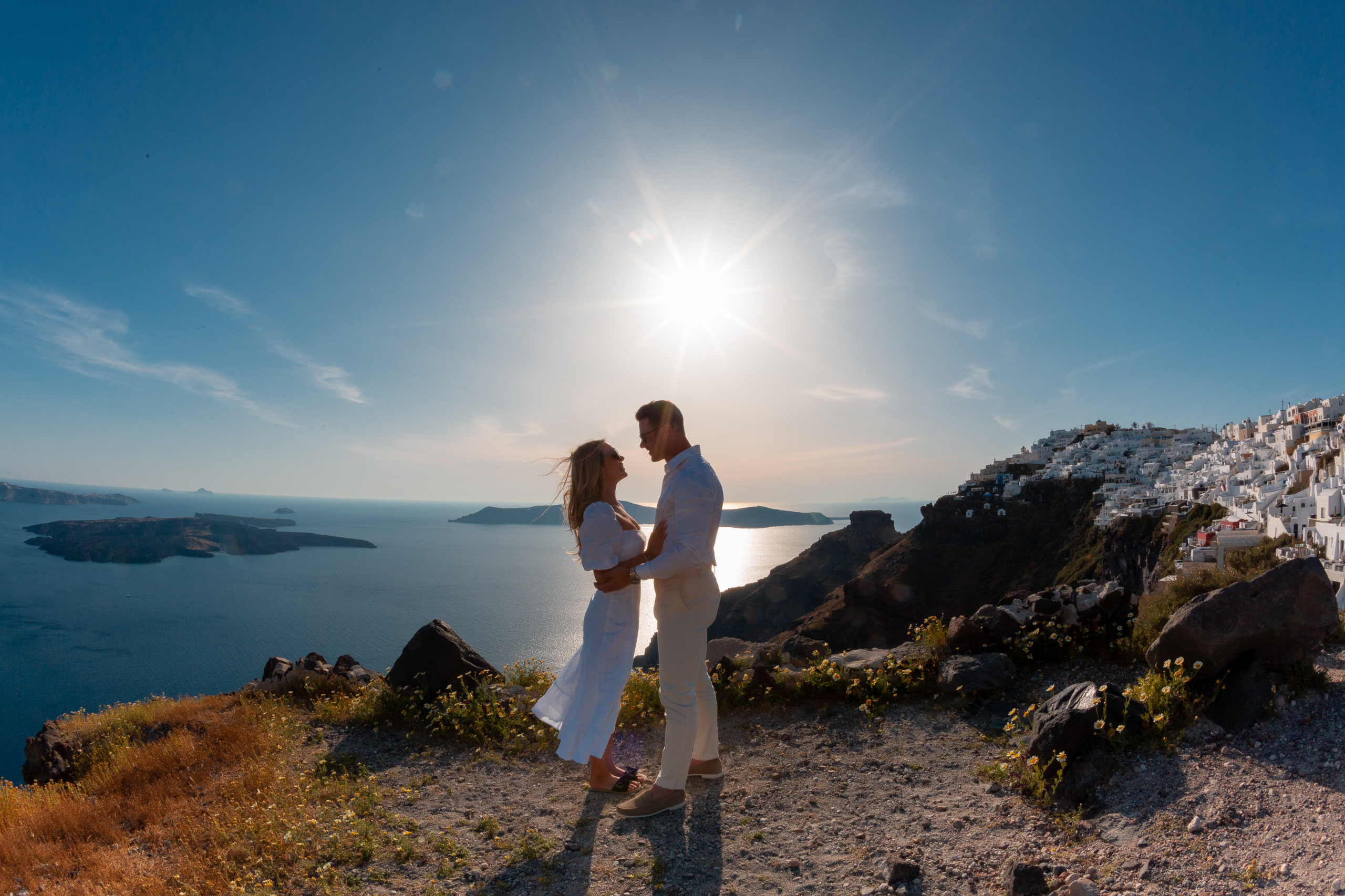 Proposal Santorini. Santorini love story photoshoot. Santorini Photographer. Santorini. Santorini Photoshoot. Flying Dress Photoshoot in Santorini. Santorini Photography.