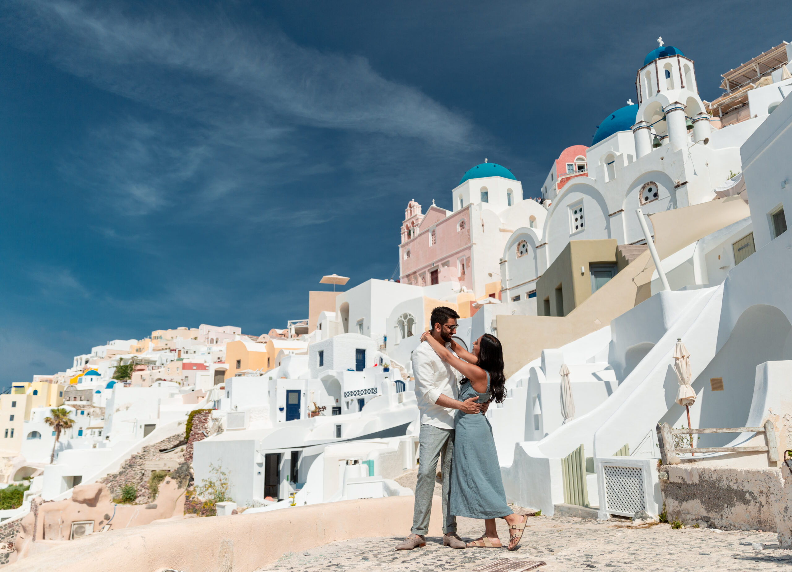 Santorini love story photoshoot. Santorini Photographer. Santorini. Santorini Photoshoot. Flying Dress Photoshoot in Santorini. Santorini Photography. Proposal Santorini