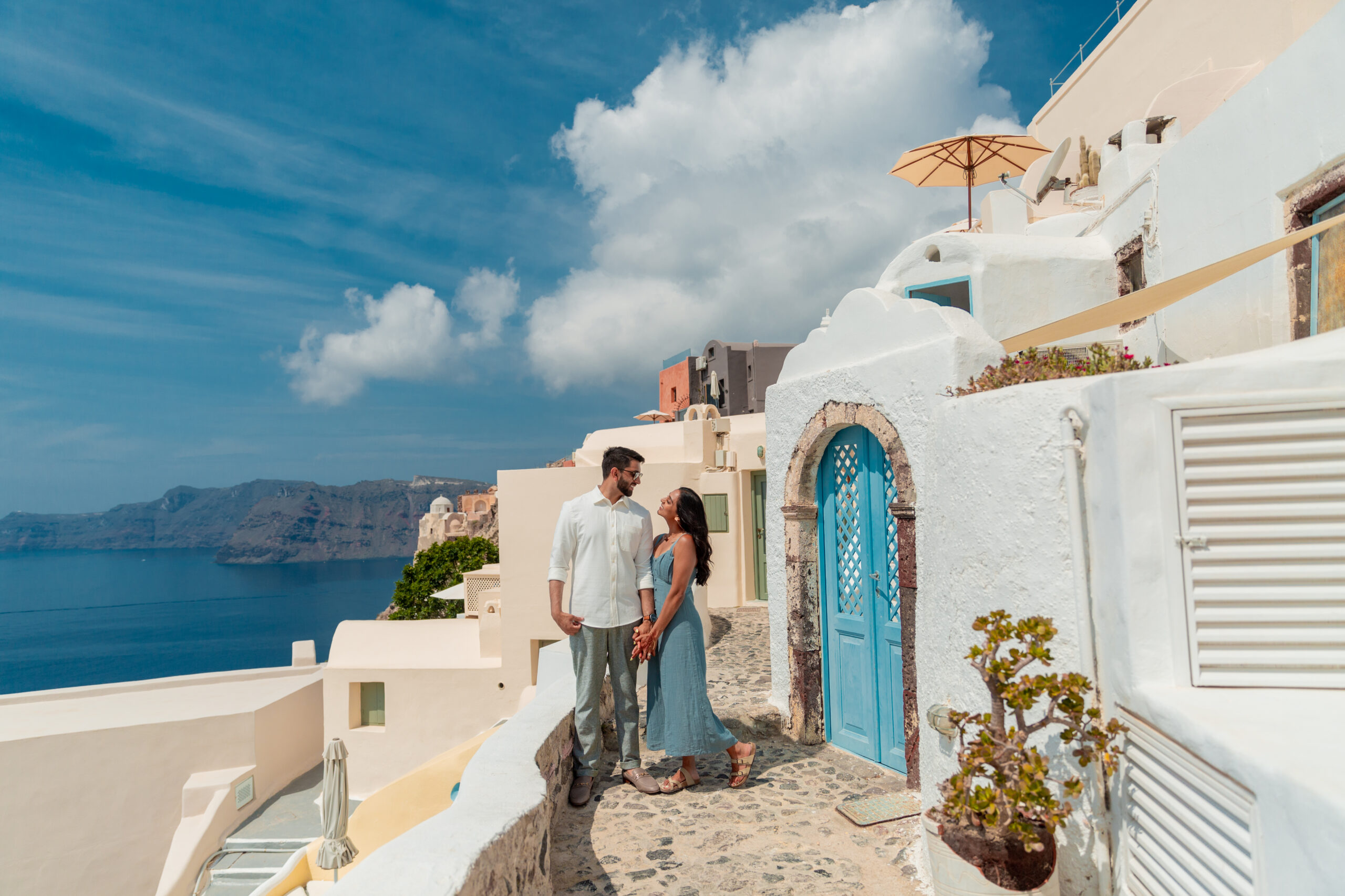 Santorini love story photoshoot. Santorini Photographer. Santorini. Santorini Photoshoot. Flying Dress Photoshoot in Santorini. Santorini Photography. Proposal Santorini