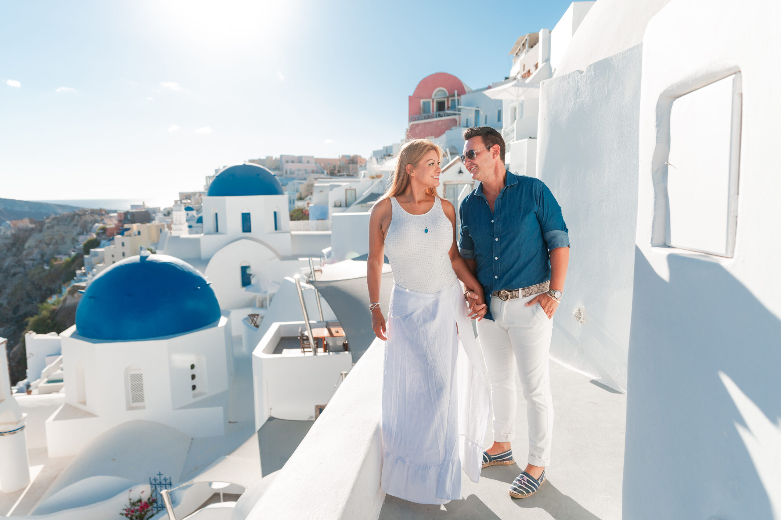 Santorini love story photoshoot. Santorini Photographer. Santorini. Santorini Photoshoot. Flying Dress Photoshoot in Santorini. Santorini Photography. Proposal Santorini