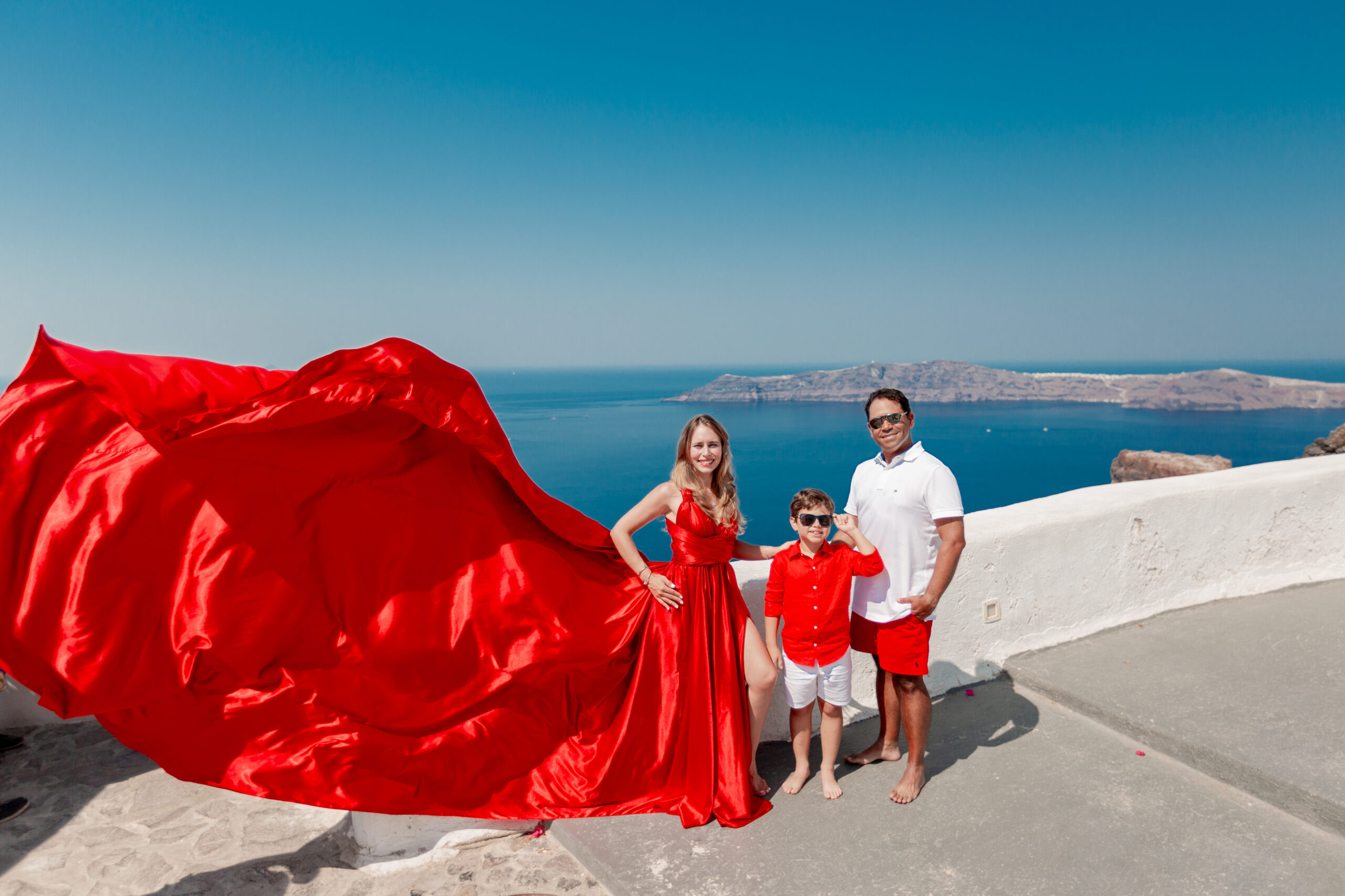 Family photoshoot in Santorini. Santorini Photographer. Santorini. Santorini Photoshoot. Flying Dress Photoshoot in Santorini. Santorini Photography.