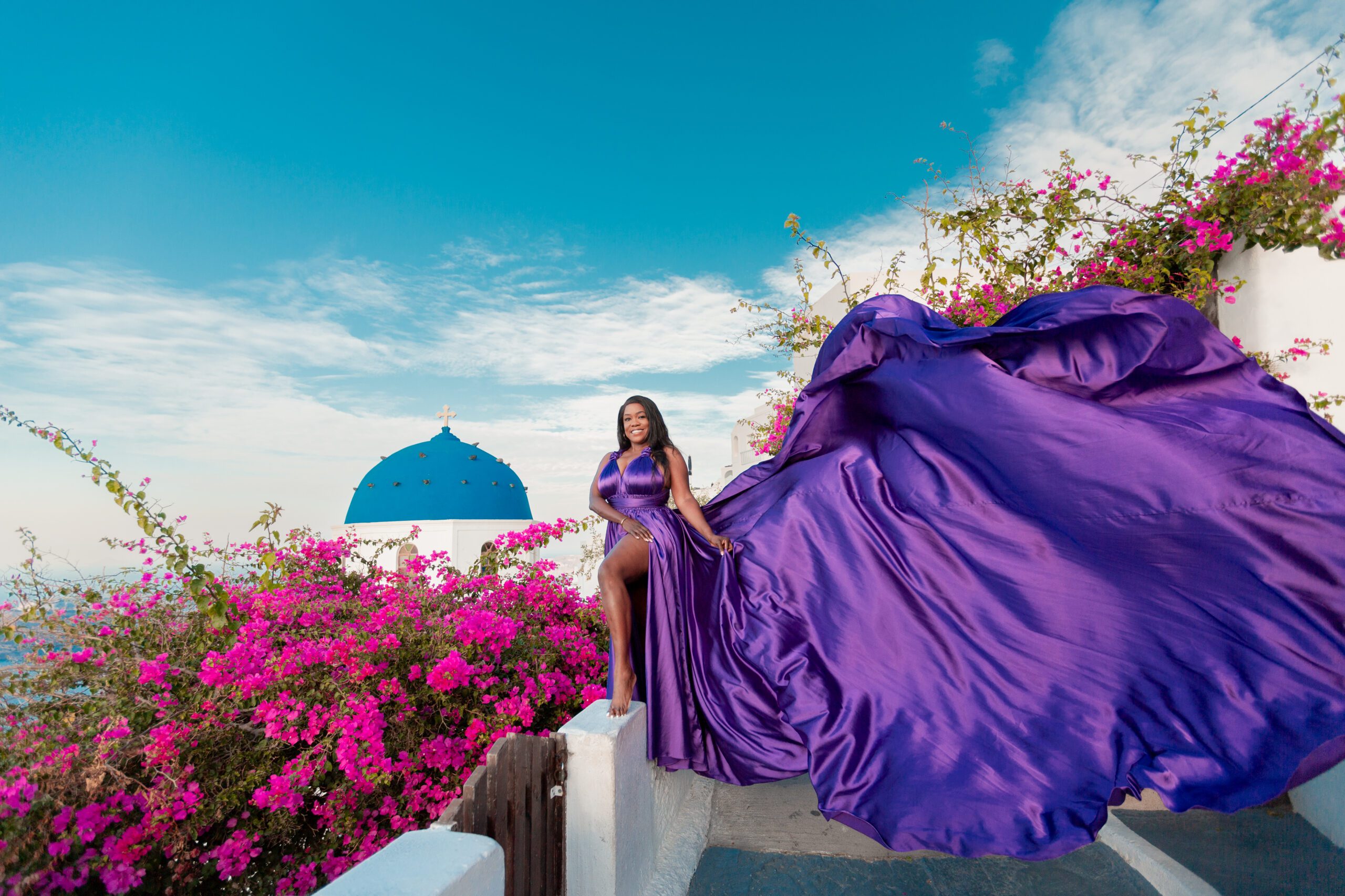 Violet flying dress for rent in Santorini — dreamy photoshoot with stunning Aegean sea views
