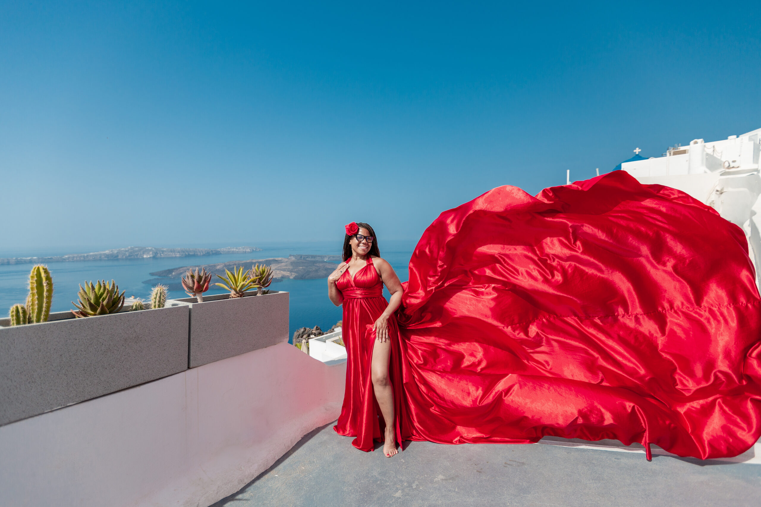 Group photoshoot in Santorini. Santorini Photographer. Santorini photo shoot with flying dress. Santorini Photoshoot. Flying Dress Photoshoot in Santorini. Santorini Photography.
