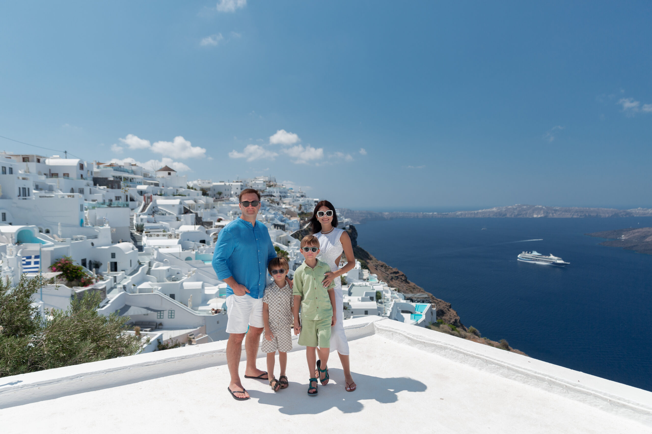 Family photoshoot in Santorini. Santorini Photographer. Santorini. Santorini Photoshoot. Flying Dress Photoshoot in Santorini. Santorini Photography.