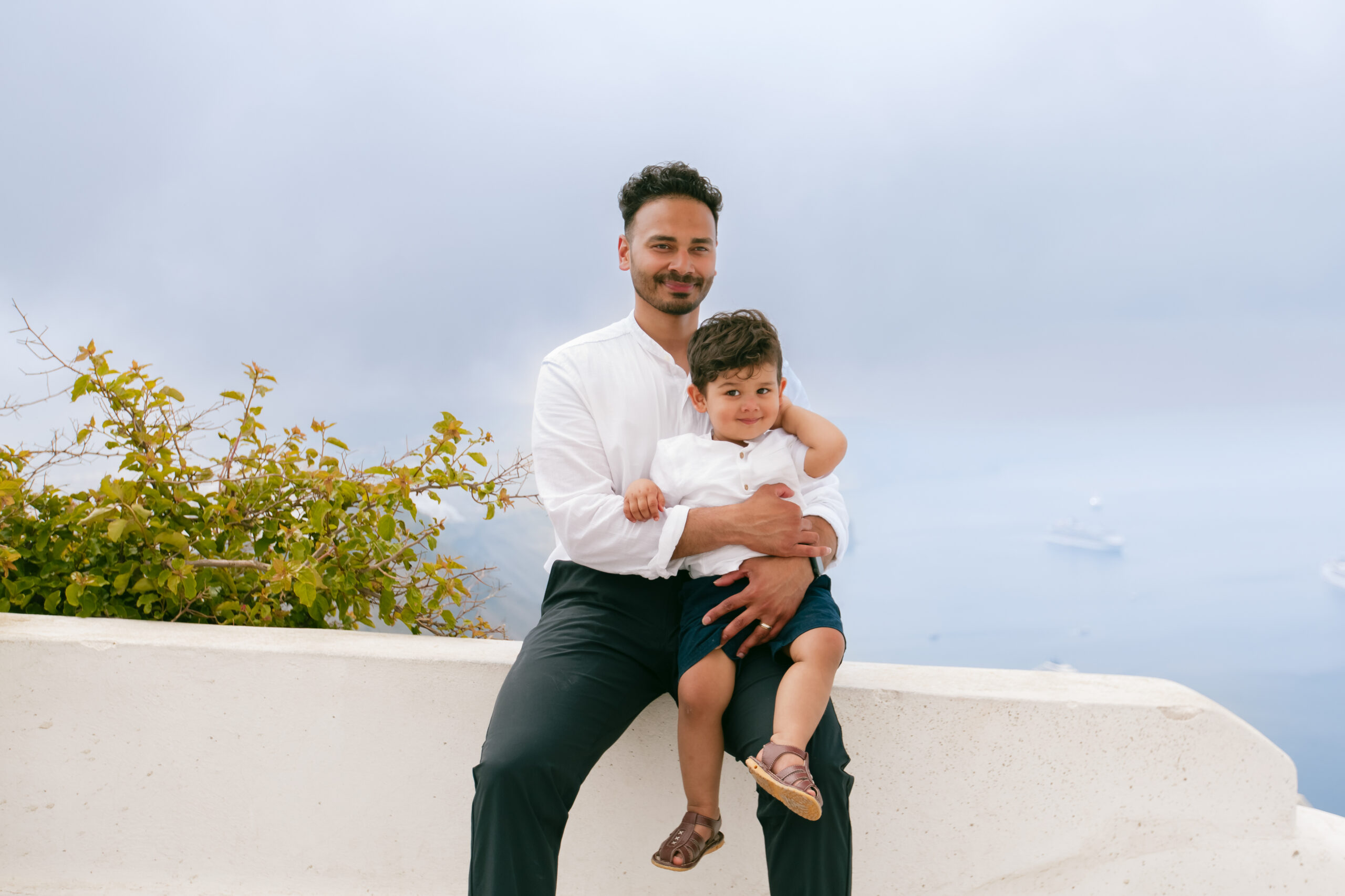 Family photoshoot in Santorini. Santorini Photographer. Santorini. Santorini Photoshoot. Flying Dress Photoshoot in Santorini. Santorini Photography.
