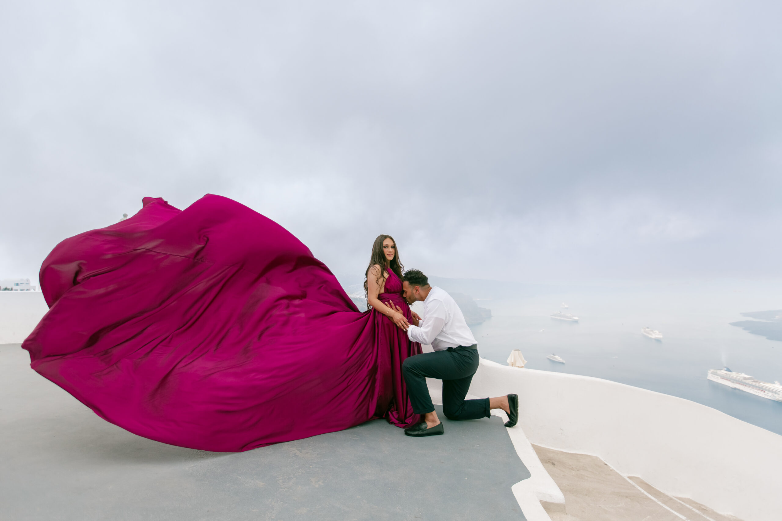 Family photoshoot in Santorini. Santorini Photographer. Santorini. Santorini Photoshoot. Flying Dress Photoshoot in Santorini. Santorini Photography.