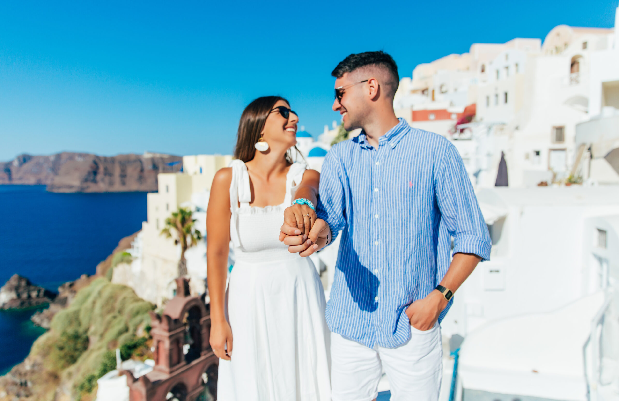 Proposal Santorini. Santorini love story photoshoot. Santorini Photographer. Santorini. Santorini Photoshoot. Flying Dress Photoshoot in Santorini. Santorini Photography.